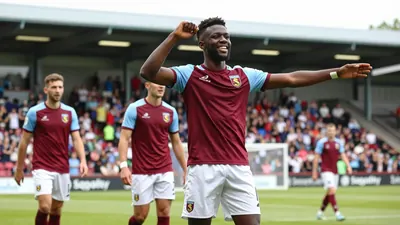 A photograph of Oyebade, a 19-year-old centre-back, celebrating with his teammates after scoring the winning goal in...
