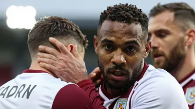 A close-up of Oldham Athletic's Mike Fondop's face as he is dragged away by his teammates after being sent off for a...