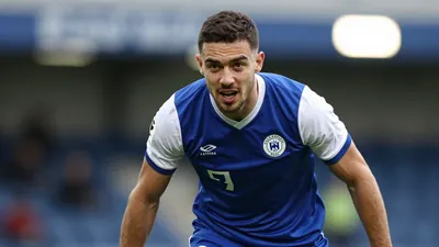A photorealistic image of an anonymous Oldham Athletic player, wearing a blue jersey with white sleeves, a white shirt...
