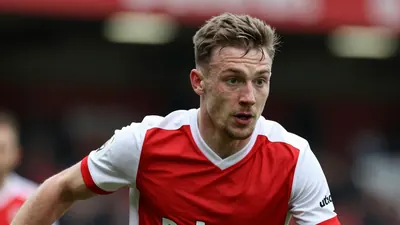 A photorealistic image of an anonymous Oldham Athletic player in a red and white kit