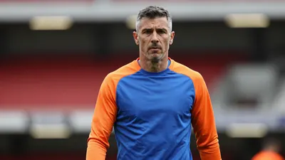 Middle-aged, muscular midfielder, late 20s, waist-up, face sharp and centered, eyes focused, wearing a plain, unmarked...
