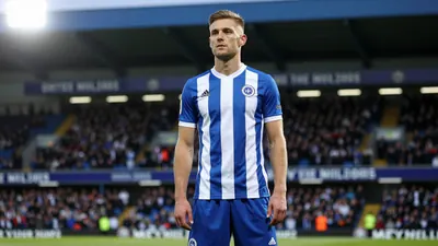 A photorealistic image of an Oldham Athletic player, wearing a blue and white striped shirt with a white collar, and blue...